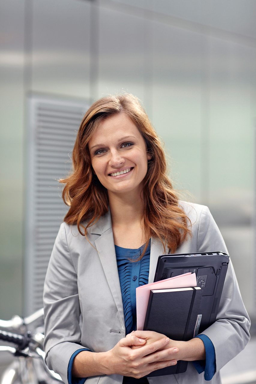 corporate photography portrait of business woman smiling at camera