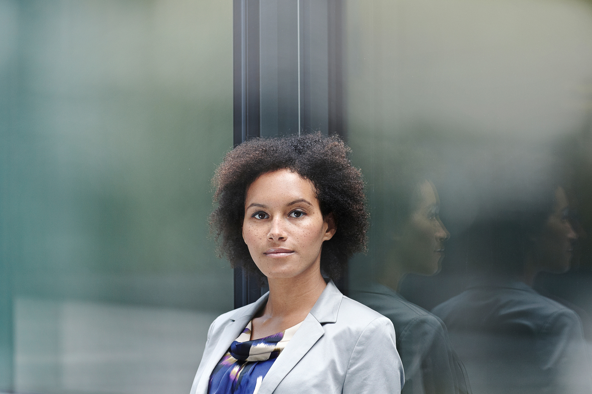 corporate photography portrait of business woman smiling looking at camera