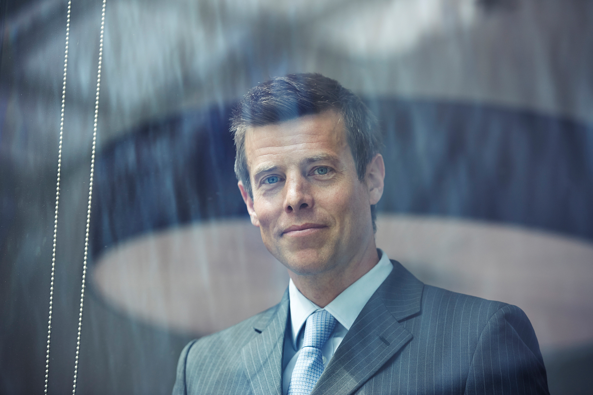 corporate photography portrait of business man smiling looking at camera
